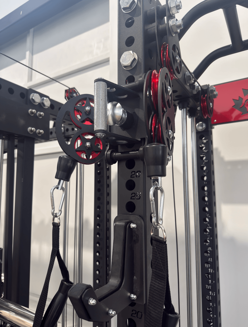 Spartaks Strength KB2402 Functional Squat Rack (3”×3”, 9-Gauge Steel) close-up of dual-pulley system and attachments.