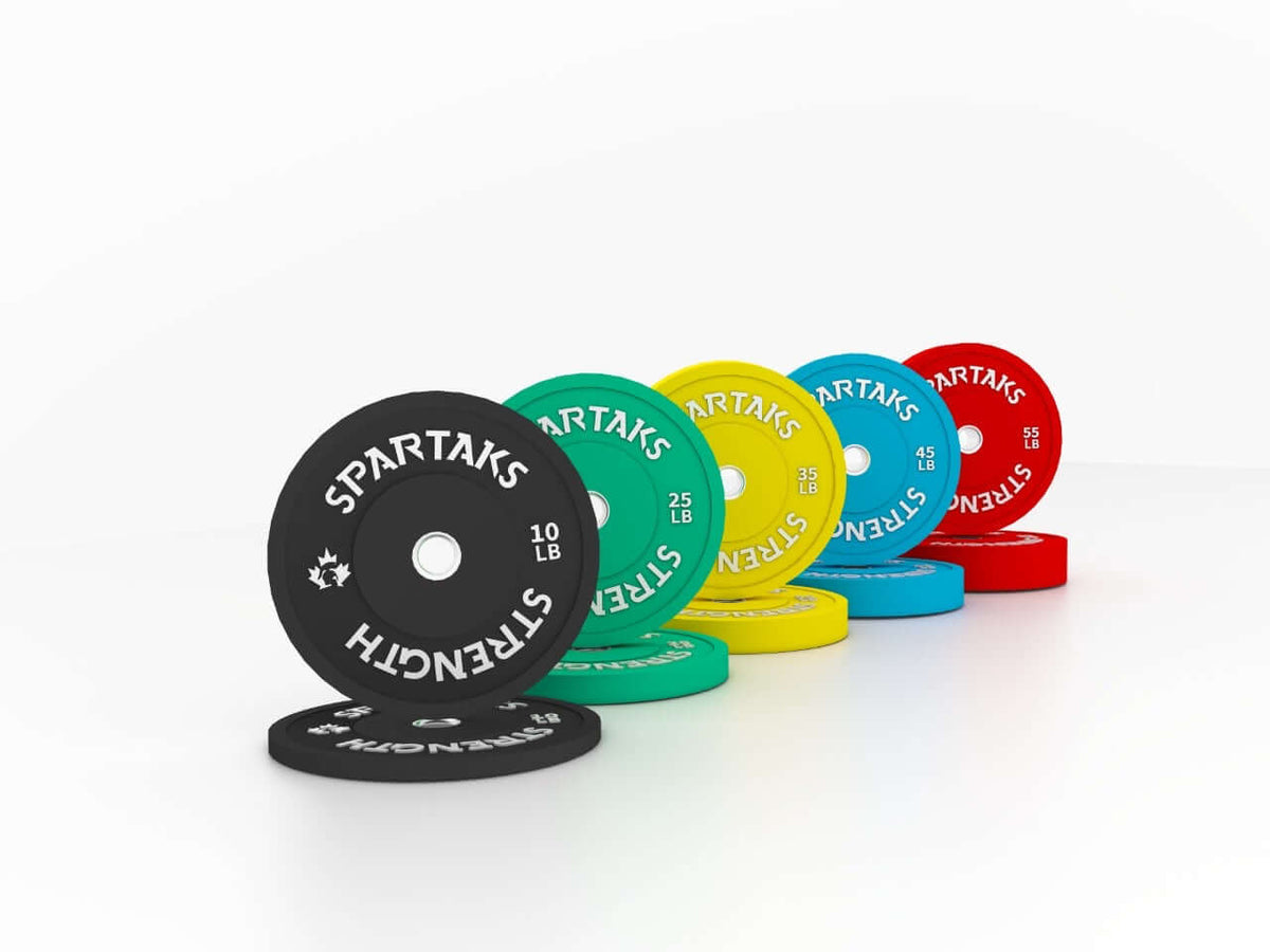 Spartaks Strength High Performance Color-Coated Bumper Plates (10LB–55LB) displayed in various weights.