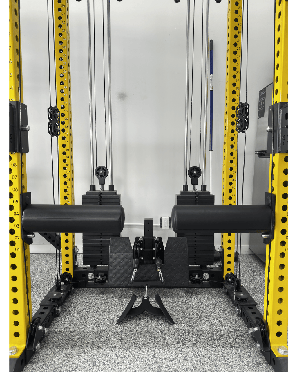 Bulgarian Knee Locker (pair) mounted on a strength training rack, ideal for home gym setup in Canada.