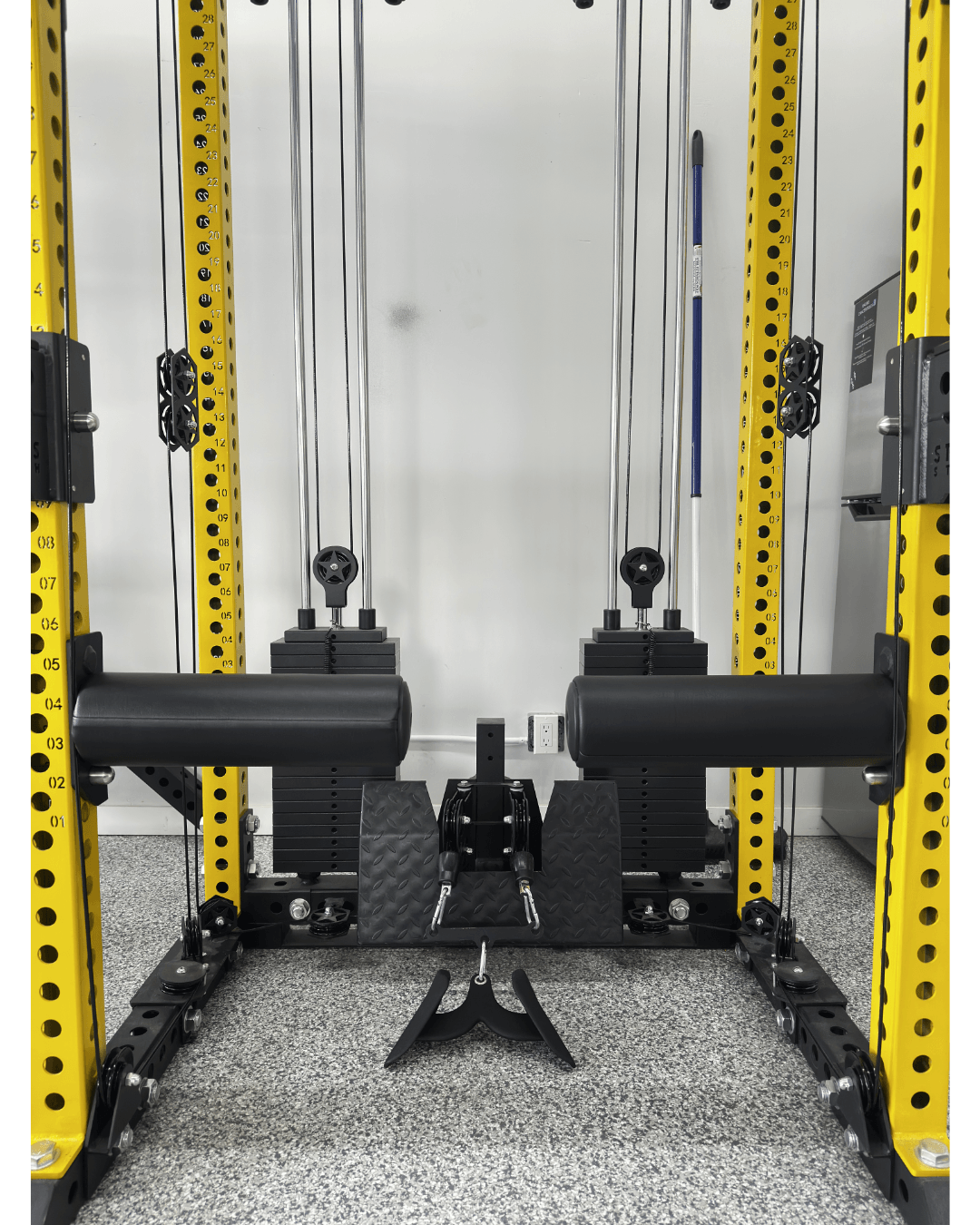 Bulgarian Knee Locker (pair) mounted on a strength training rack, ideal for home gym setup in Canada.