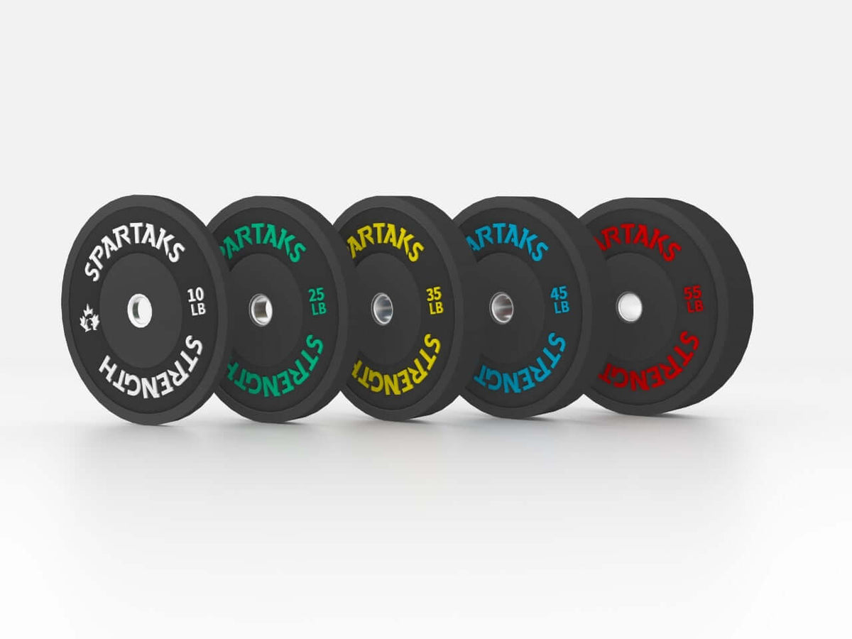 Spartaks Strength High Performance Bumper Plates (10LB to 55LB) showcasing different weight options in high-quality rubber.