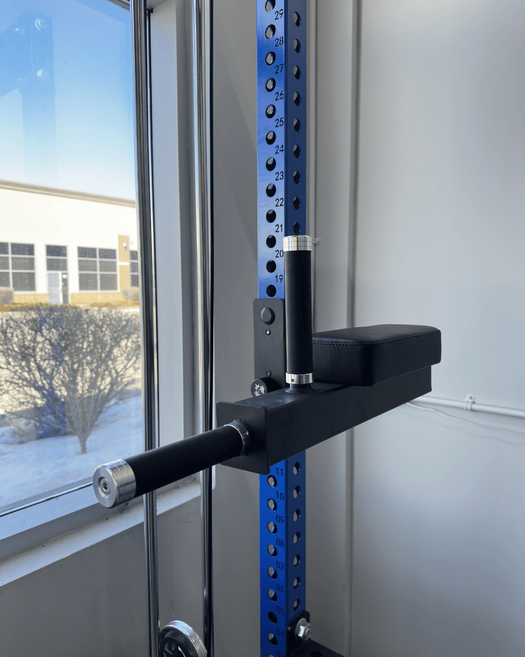 Spartaks Strength Leg Raise and Dip Combo Rack Attachment installed on a rack, showcasing heavy-duty steel design.